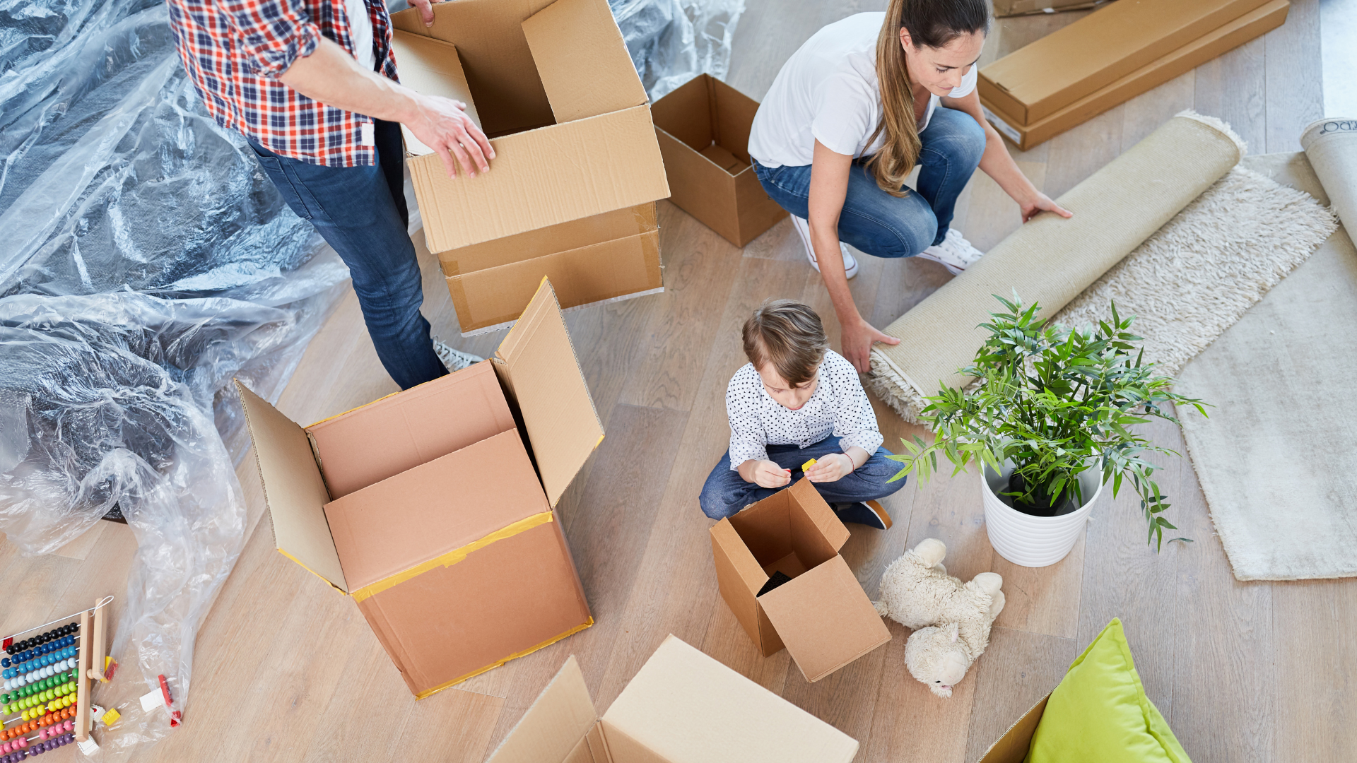 A family packing moving boxes