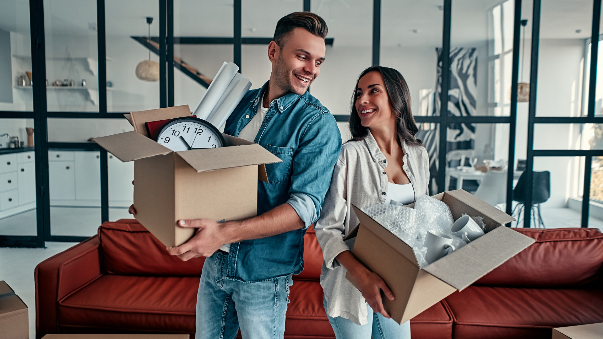 Happy young couple moving in their new house