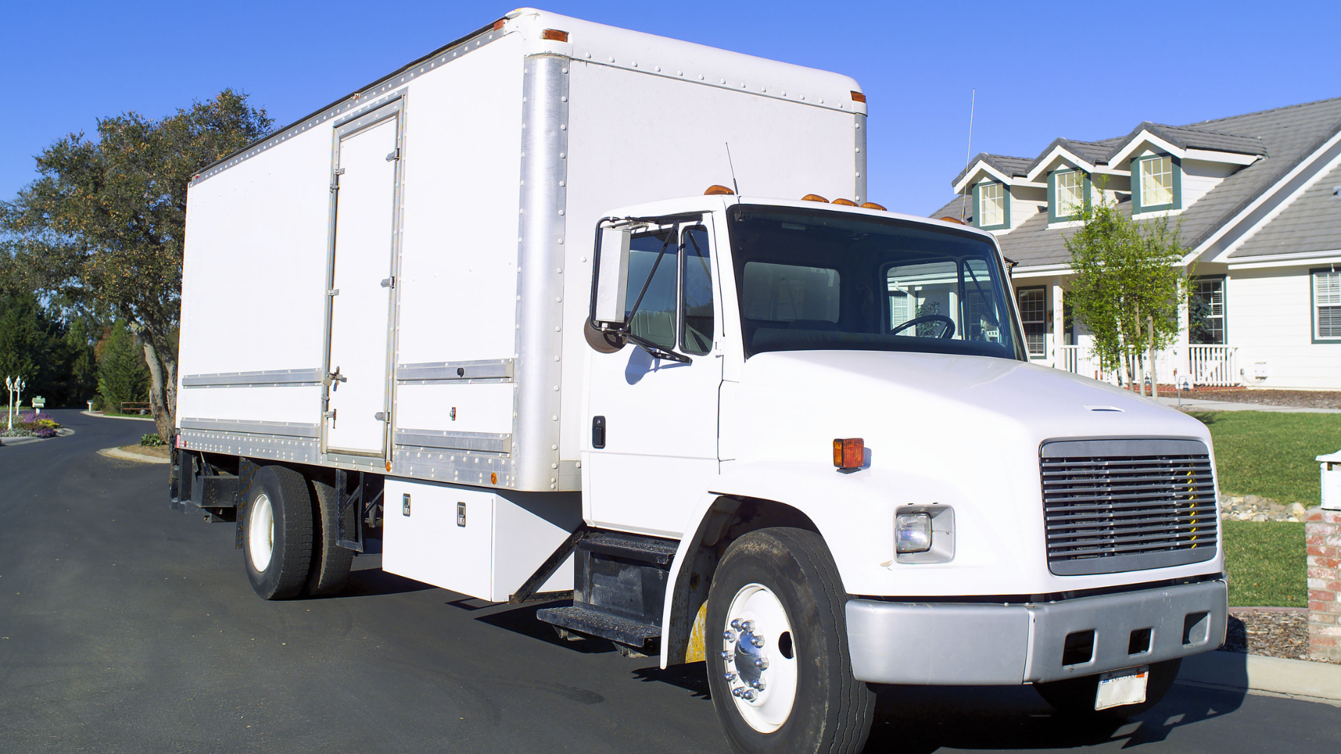 Moving truck parked outside the house