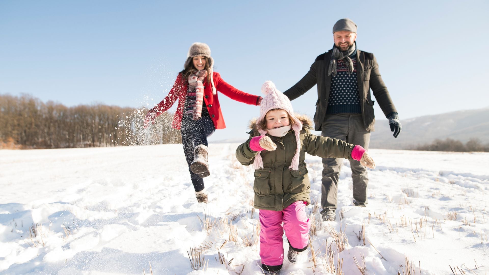 Family playing in snow