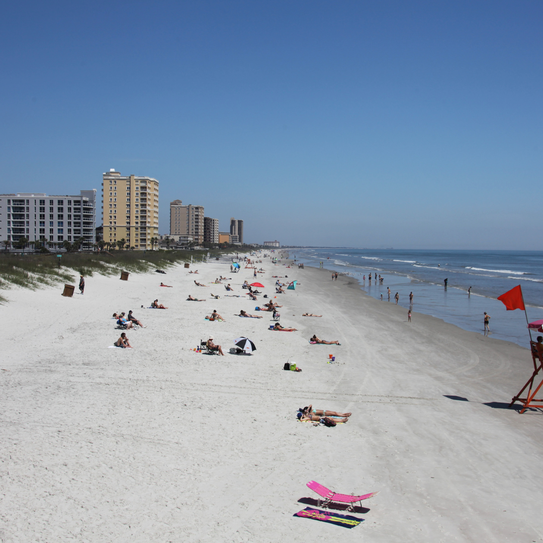 alt="A bright, clear blue sky over Jacksonville Beach"