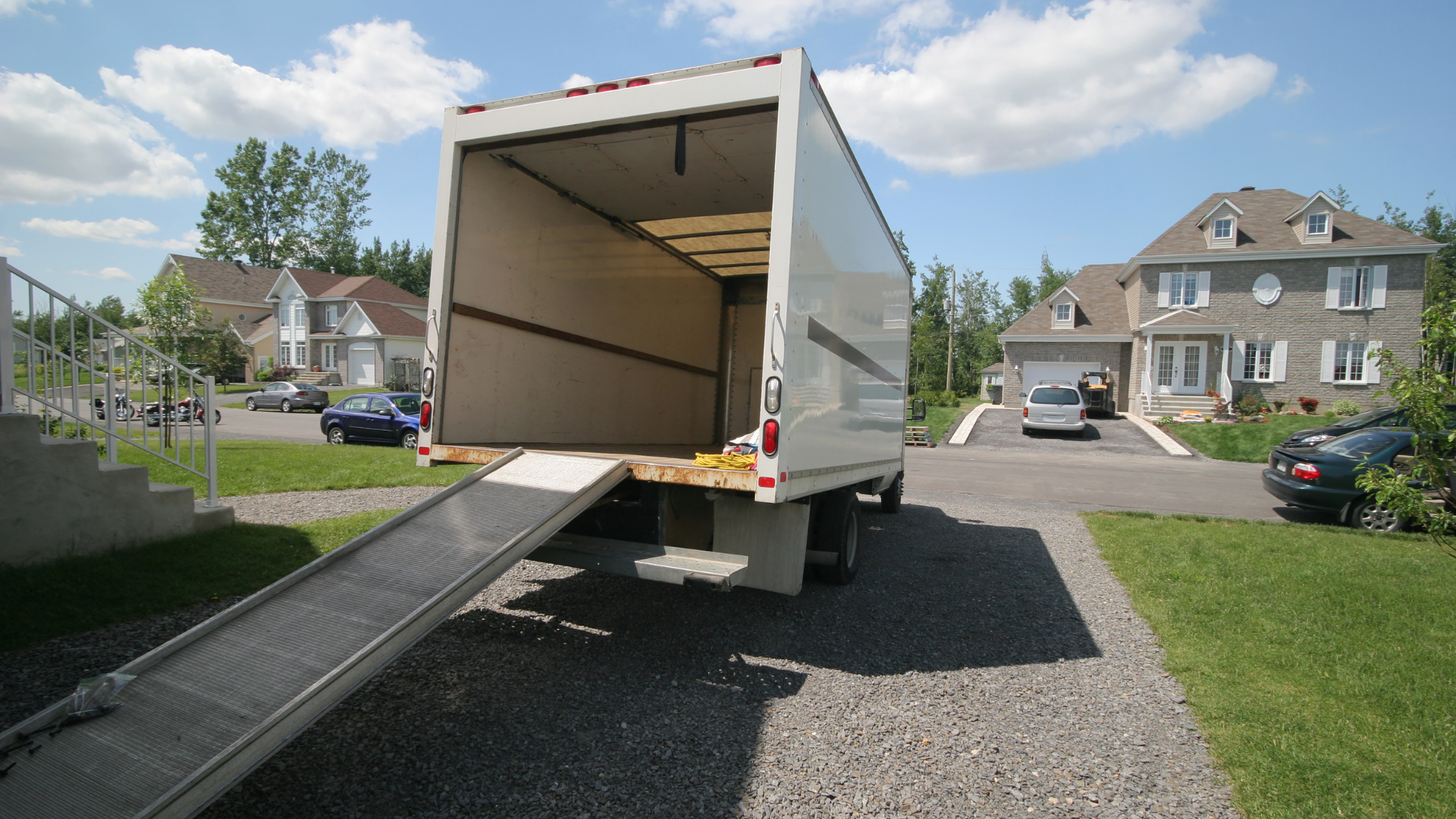 Open moving truck with rump on a sunny day