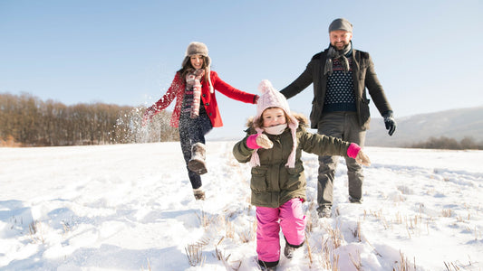Family playing in snow